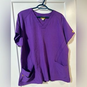 Vibrant purple like new Wonder Wink scrub top for healthcare workers nurses etc